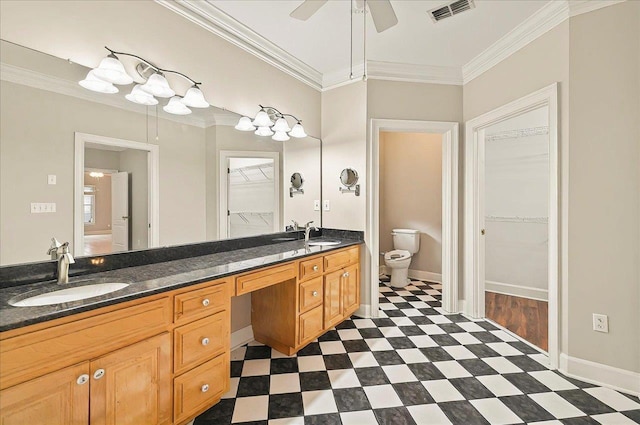 370 Rob Roy Trl, Tallahassee, FL 32312 - bathroom featuring tile patterned floors, toilet, double vanity, ornamental molding, and a walk in closet
