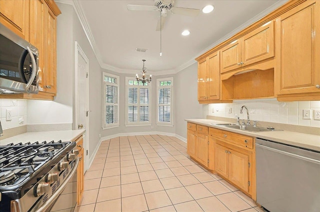 370 Rob Roy Trl, Tallahassee, FL 32312 - kitchen featuring appliances with stainless steel finishes, a sink, light countertops, tasteful backsplash, and crown molding