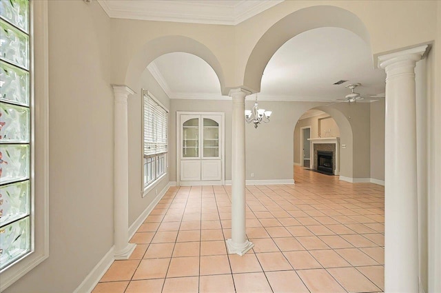 370 Rob Roy Trl, Tallahassee, FL 32312 - spare room featuring ceiling fan, a fireplace, ornamental molding, light tile patterned floors, and baseboards