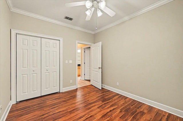 370 Rob Roy Trl, Tallahassee, FL 32312 - unfurnished bedroom featuring wood finished floors, crown molding, baseboards, a closet, and a ceiling fan
