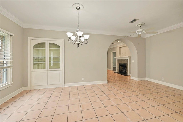 370 Rob Roy Trl, Tallahassee, FL 32312 - empty room with crown molding, ceiling fan, arched walkways, a chandelier, and a fireplace with flush hearth