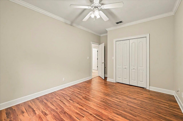 370 Rob Roy Trl, Tallahassee, FL 32312 - unfurnished bedroom with wood finished floors, ornamental molding, baseboards, a closet, and a ceiling fan