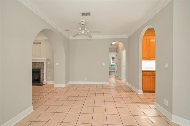 370 Rob Roy Trl, Tallahassee, FL 32312 - spare room featuring ceiling fan, crown molding, light tile patterned floors, a fireplace, and baseboards