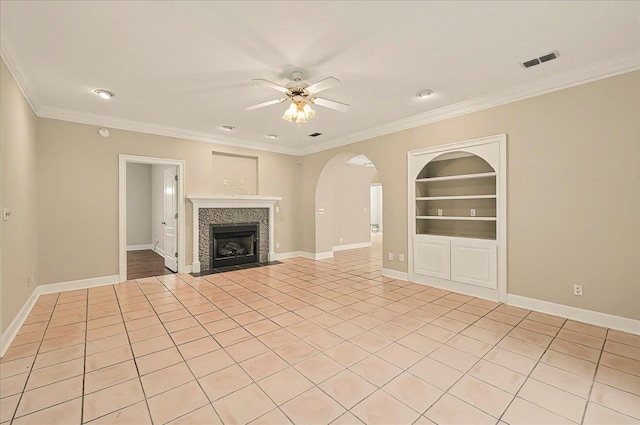 370 Rob Roy Trl, Tallahassee, FL 32312 - unfurnished living room with ceiling fan, built in features, crown molding, and baseboards