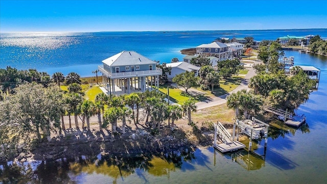 birds eye view of property with a water view