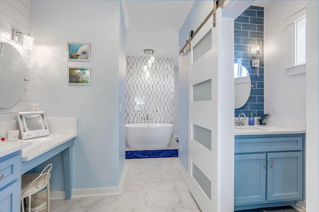 bathroom with a bathtub, vanity, and ornamental molding