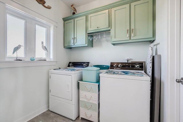 laundry room with cabinets and washing machine and dryer