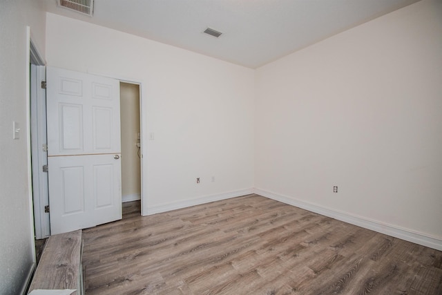 spare room with light wood-type flooring