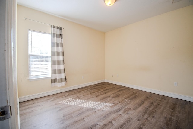 empty room featuring hardwood / wood-style floors