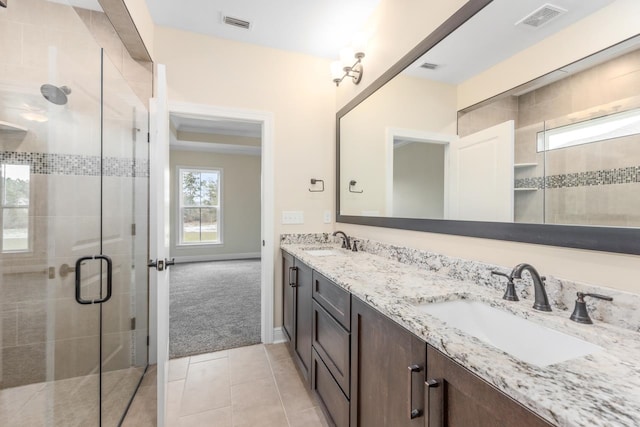 273 Springdale Dr, Crawfordville, FL 32327 - full bathroom featuring double vanity, a shower stall, and tile patterned flooring