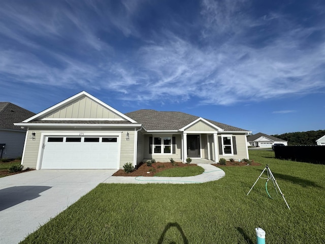 273 Springdale Dr, Crawfordville, FL 32327 - ranch-style house with a front yard, concrete driveway, an attached garage, and board and batten siding