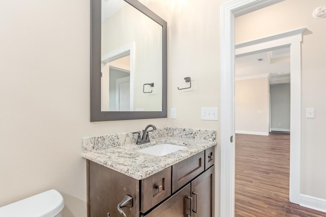 273 Springdale Dr, Crawfordville, FL 32327 - half bath with crown molding, vanity, and wood finished floors