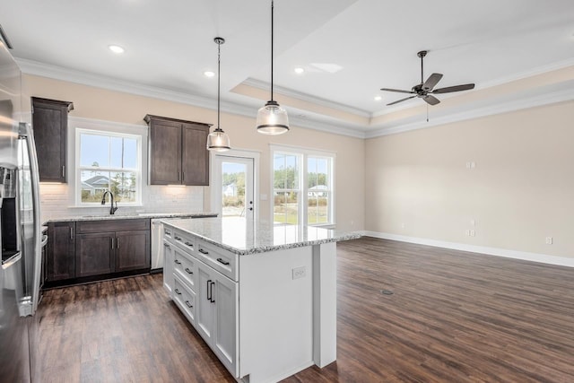 273 Springdale Dr, Crawfordville, FL 32327 - kitchen featuring a ceiling fan, tasteful backsplash, dark wood-type flooring, ornamental molding, and dark brown cabinetry