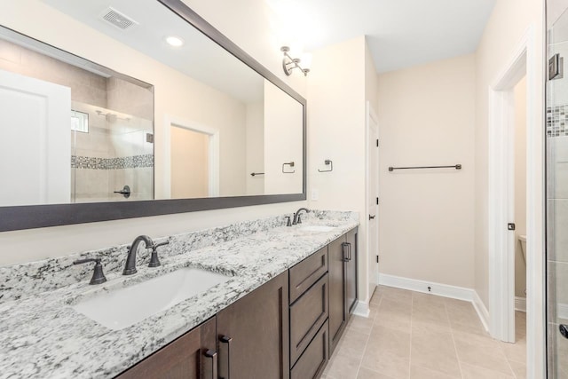 273 Springdale Dr, Crawfordville, FL 32327 - full bath with double vanity, a shower stall, tile patterned flooring, and recessed lighting