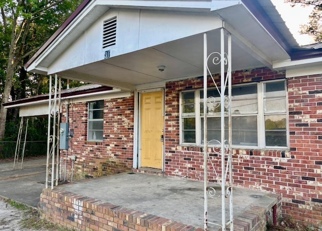 exterior space with brick siding