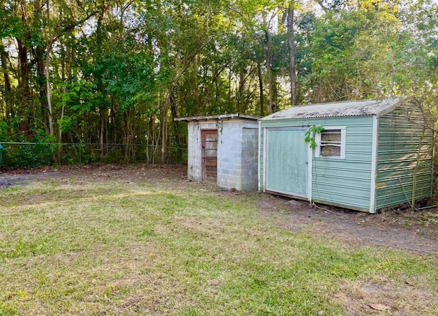 view of shed with fence