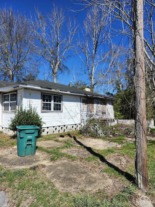 view of home's exterior with crawl space