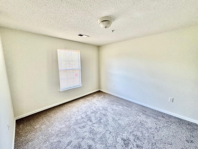 3000 S Adams St Unit 234, Tallahassee, FL 32301 - carpeted empty room with a textured ceiling and baseboards