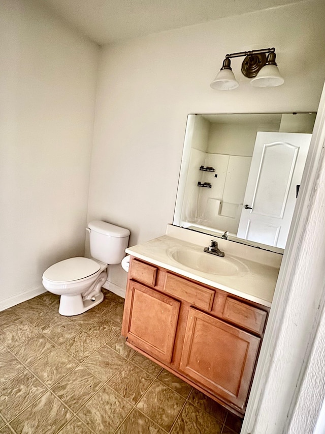 3000 S Adams St Unit 234, Tallahassee, FL 32301 - bathroom featuring vanity, toilet, and baseboards
