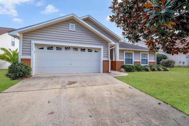 view of front facade with a garage, a front yard, concrete driveway, and brick siding