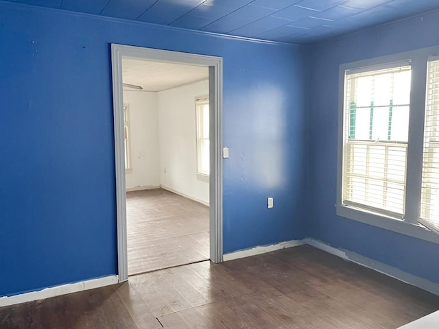 empty room with hardwood / wood-style floors