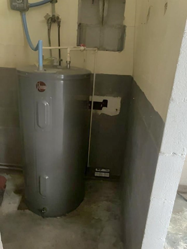 utility room featuring water heater