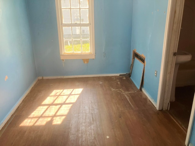 empty room with dark hardwood / wood-style floors