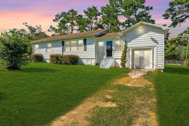 view of front of home featuring a yard