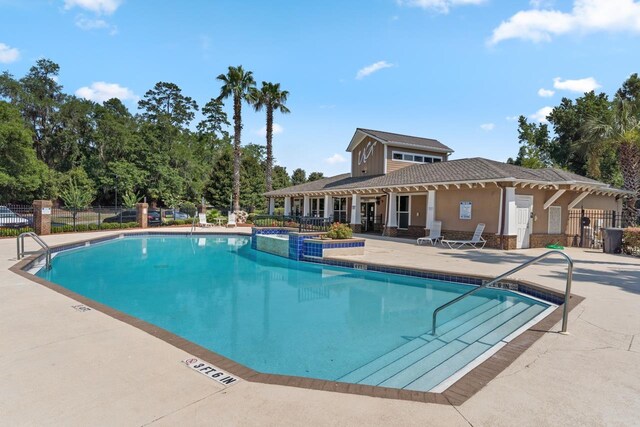 view of swimming pool featuring a patio area