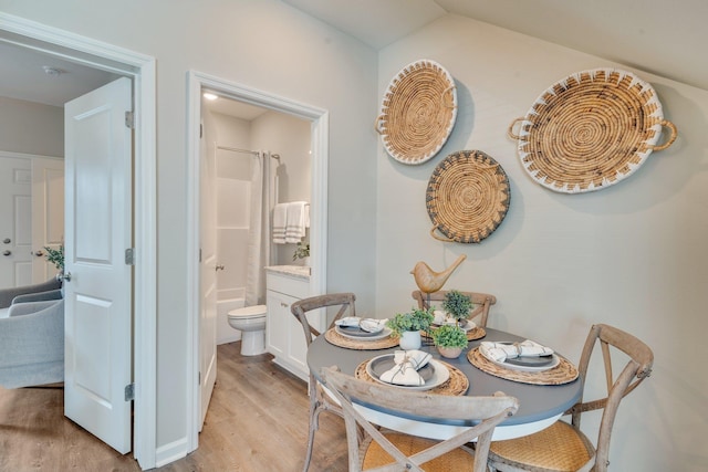 dining space with light hardwood / wood-style flooring