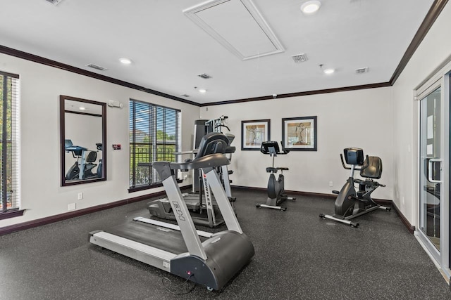 exercise room featuring crown molding