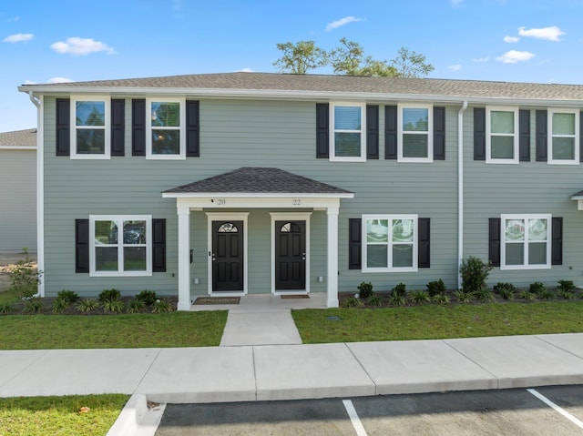 view of front of home with a front lawn