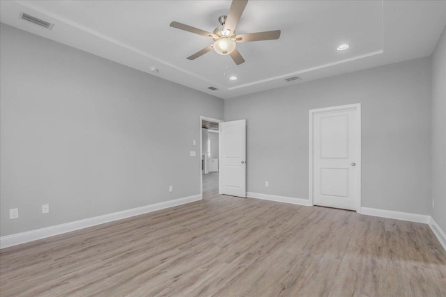 unfurnished bedroom with baseboards, visible vents, light wood-style flooring, and recessed lighting
