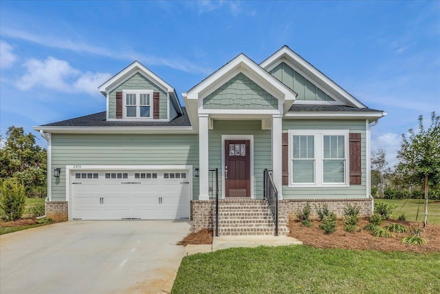 craftsman-style home with driveway and board and batten siding