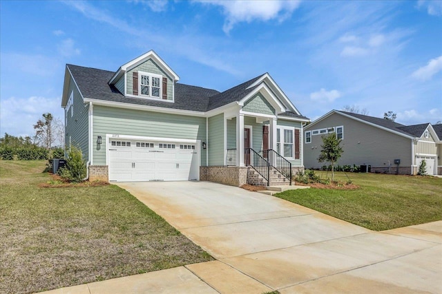 view of front of home with an attached garage, concrete driveway, and a front yard