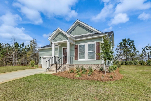 craftsman-style house with board and batten siding, concrete driveway, a front lawn, and a garage