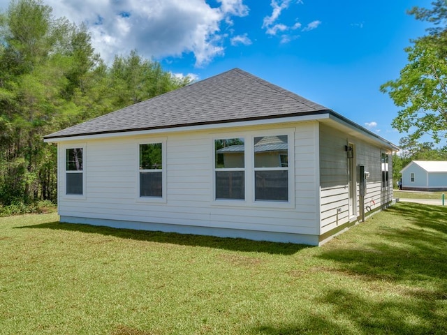 view of home's exterior with a lawn