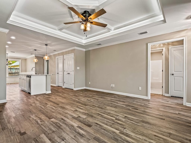 unfurnished living room featuring ceiling fan, dark hardwood / wood-style flooring, sink, and ornamental molding