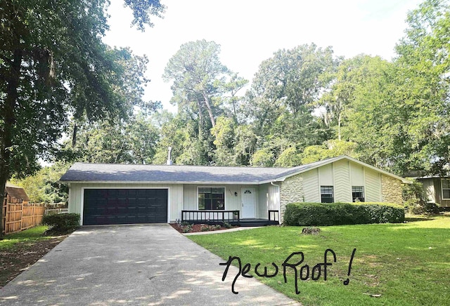 2305 Carrick Ct, Tallahassee, FL 32309 - view of front of property with a garage, driveway, and stone siding