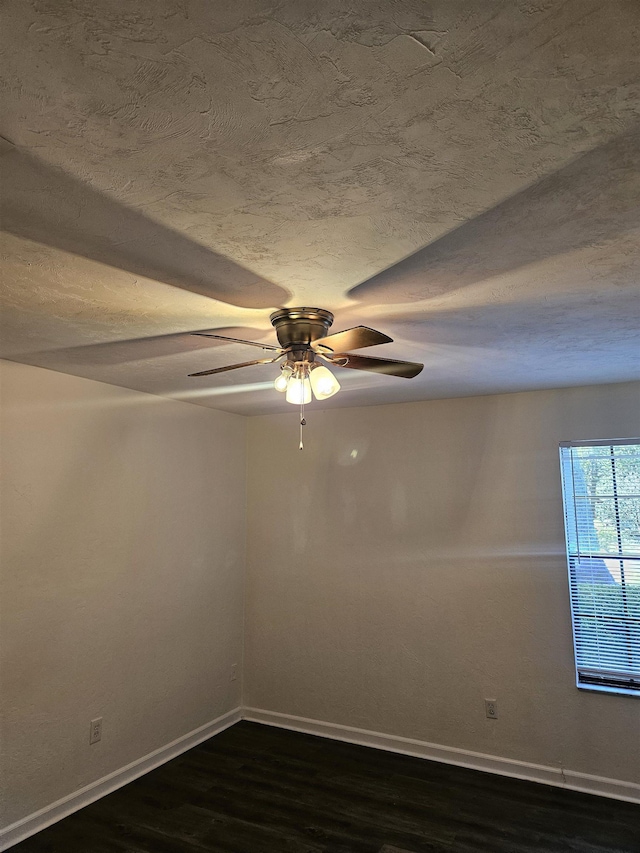 2305 Carrick Ct, Tallahassee, FL 32309 - unfurnished room with dark wood-type flooring, baseboards, ceiling fan, and a textured ceiling