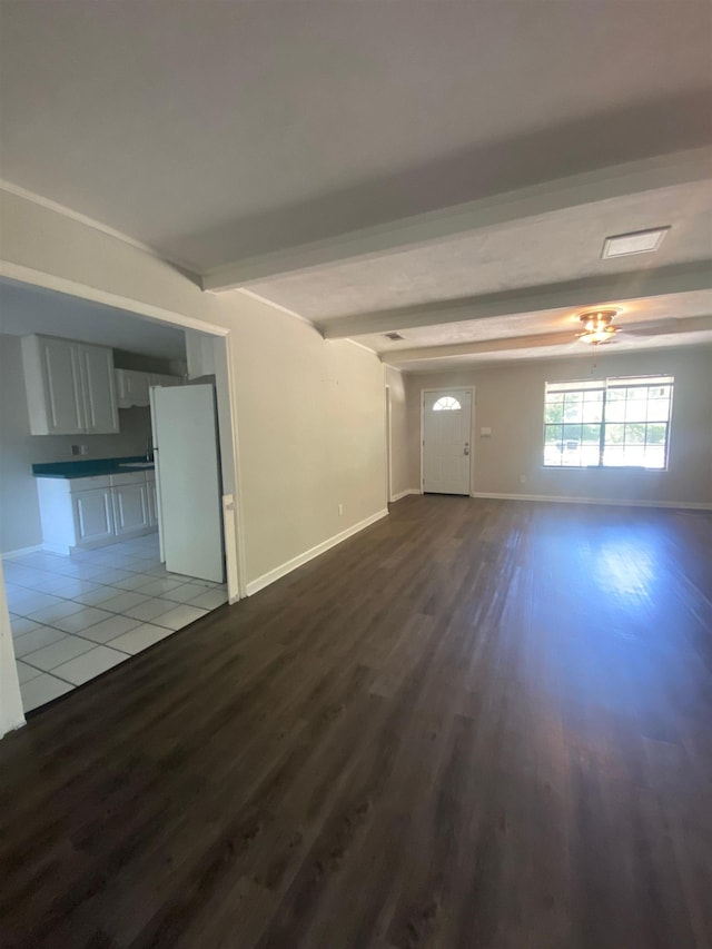 2305 Carrick Ct, Tallahassee, FL 32309 - unfurnished living room featuring wood finished floors, beamed ceiling, and baseboards