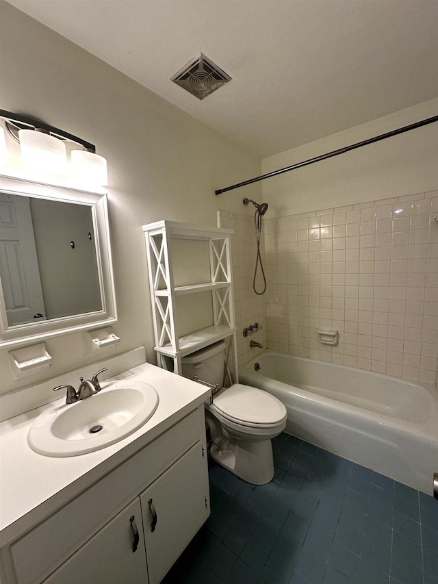 2305 Carrick Ct, Tallahassee, FL 32309 - full bathroom with tile patterned floors, vanity, shower / bathtub combination, and toilet