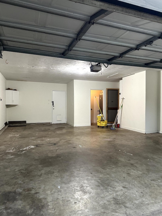 2305 Carrick Ct, Tallahassee, FL 32309 - garage featuring a garage door opener and baseboards