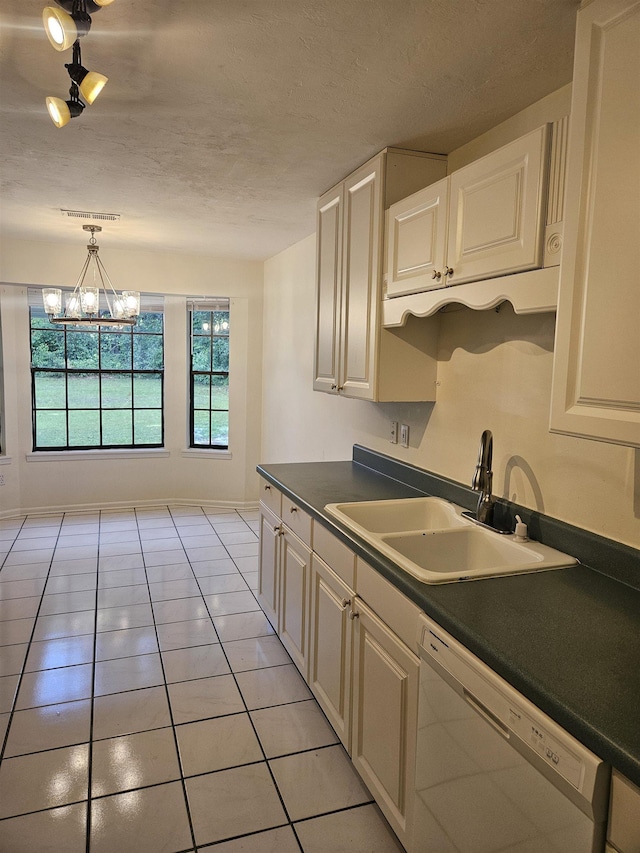 2305 Carrick Ct, Tallahassee, FL 32309 - kitchen featuring dishwasher, a sink, dark countertops, light tile patterned flooring, and white cabinetry