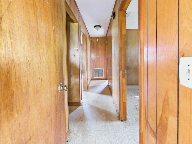 302 Goff St, Perry, FL 32347 - hallway featuring wooden walls and tile patterned floors