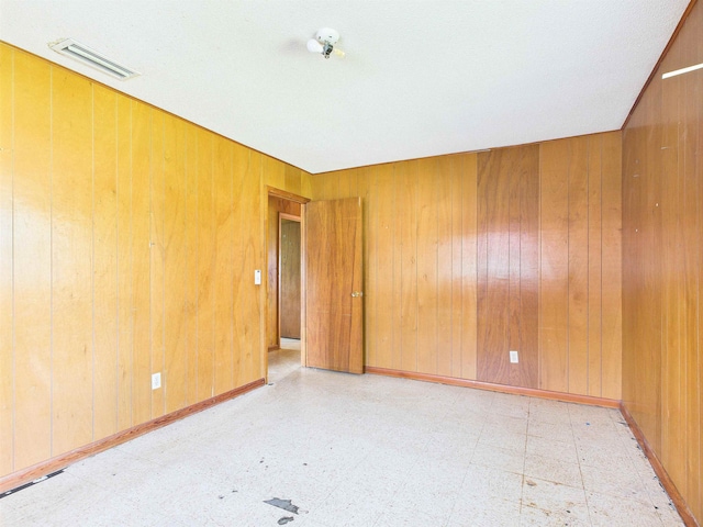 302 Goff St, Perry, FL 32347 - unfurnished room with tile patterned floors and wooden walls