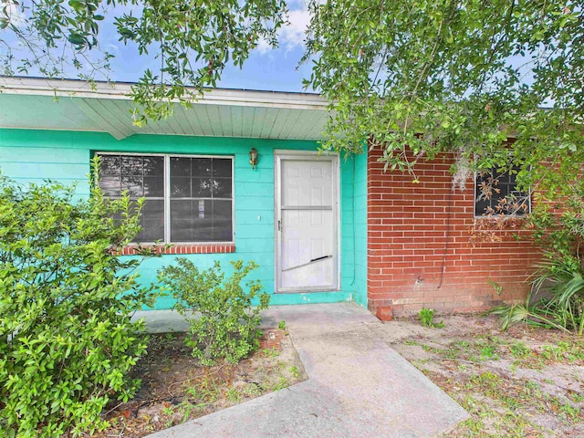 302 Goff St, Perry, FL 32347 - view of exterior entry with brick siding