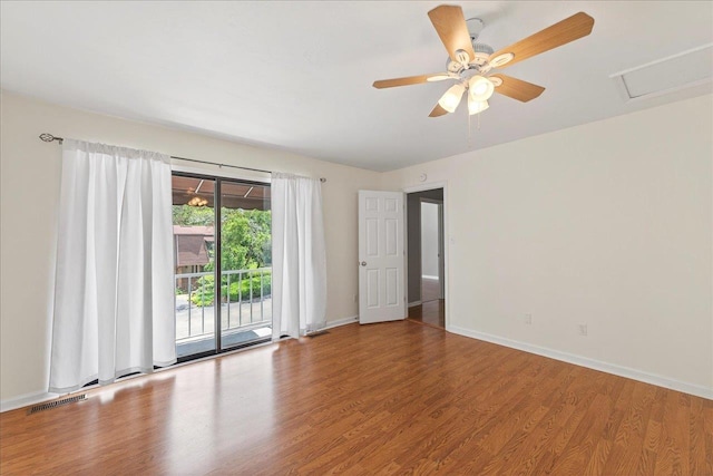 2965 N Shamrock, Tallahassee, FL 32309 - spare room featuring wood finished floors, attic access, and a ceiling fan