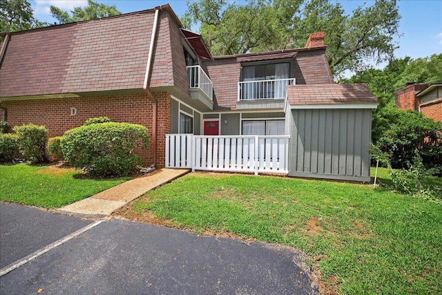 2965 N Shamrock, Tallahassee, FL 32309 - view of front of home with brick siding, mansard roof, and a front lawn
