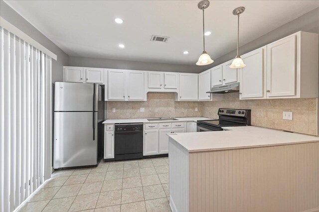 2965 N Shamrock, Tallahassee, FL 32309 - kitchen featuring freestanding refrigerator, electric range, dishwasher, under cabinet range hood, and light countertops